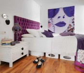 a white bedroom design with a purple touch