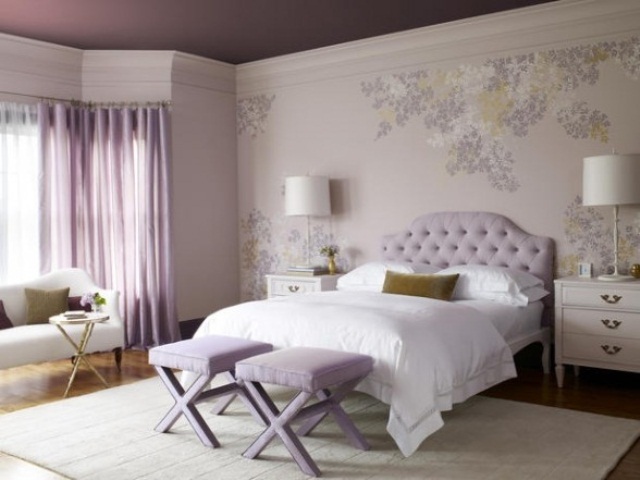 a romantic girlish bedroom with a purple ceiling, floral walls, a lavender bed and stools, curtains, mustard touches