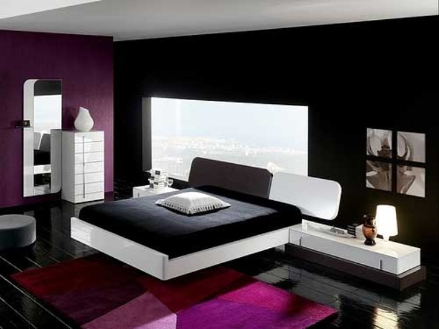 a contrasting black, white and purple bedroom with a window, black and white furniture, a mirror and a view