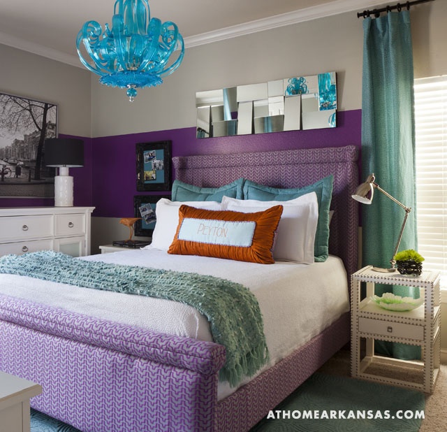 a colorful bedroom with a color block purple and white wall, a purple bed and touches of turquoise and aqua is very fun and bold