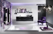 a bright eclectic bathroom with pendant sphere lamps, a purple statement wall and a chic purple chair plus lavender touches