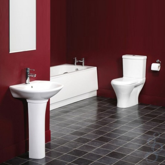 a minimalist bathroom in burgundy, grey tiles on the floor and white appliances for a bold and chic look