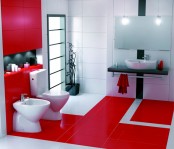 a bright minimalist bathroom in red and white, with white appliances and lots of light