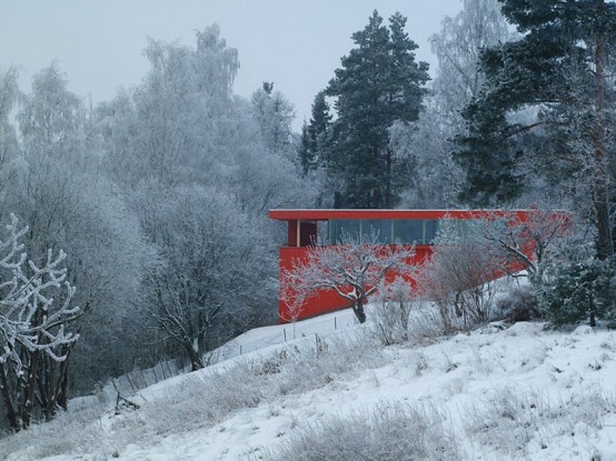 Red Wooden House In Snowy Area