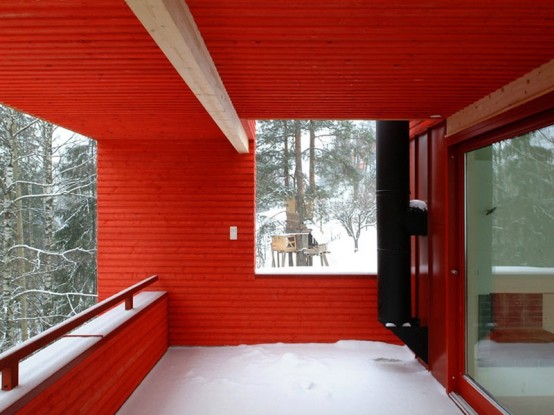 Red Wooden House In Snowy Area