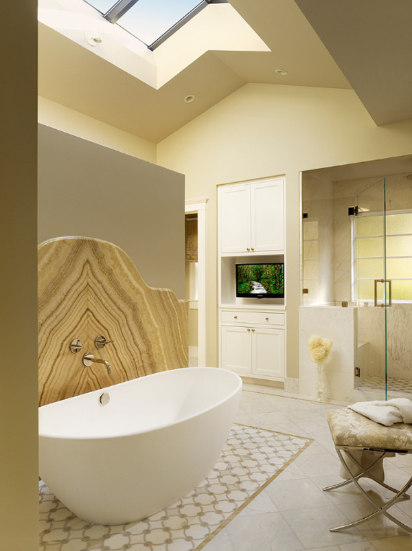 a contemporary bathroom with skylights, a shower space, cabinets and a TV, a beautiful onyx backsplash next to the bathtub