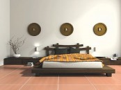 a zen-inspired Asian bedroom with low wooden furniture in Asian style, neutral bedding, branches and decorative plates on the wall