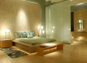 a neutral and pastel bedroom with a zen feel, Asian style neutral furniture of wood, a wood wall, pastel green bedding, a green sliding door and some lights