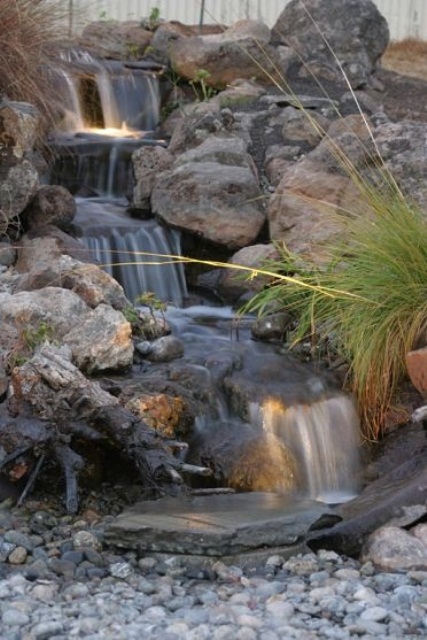 Under water lighting is a great addition  to any backayrd waterfall.