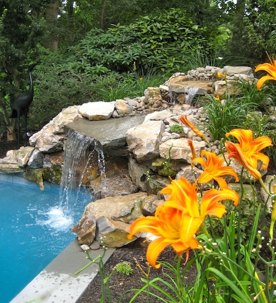 Waterfalls help contemporary pools to fit natural environments better.