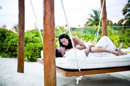 a simple hanging bed of wood and ropes is a great relaxation piece for any space, from tropical to rustic