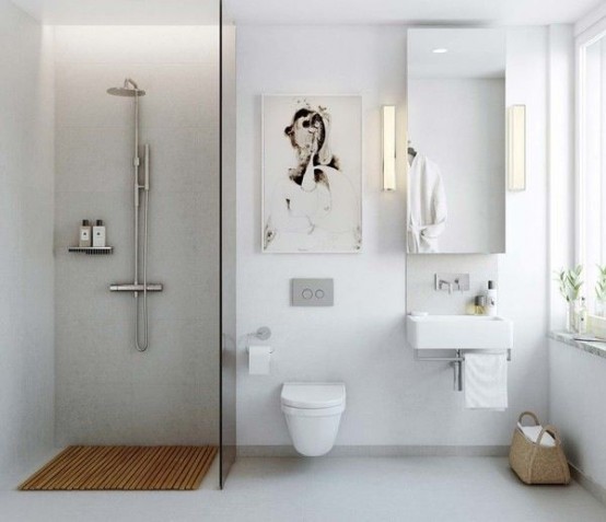 a fresh white Scandinavian bathroom with an artwork, a mirror and a shower space with a wooden mat