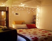 a light and sheer canopy with lights over the bed is classics