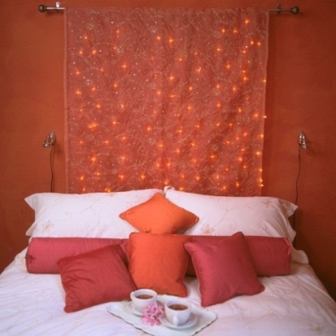 a beautiful embroidered curtain with integrated red lights fits the space decor perfectly