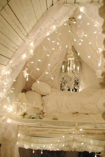 lights hanging over the bed as a canopy is a cool and romanti idea to flood your bedroom with light
