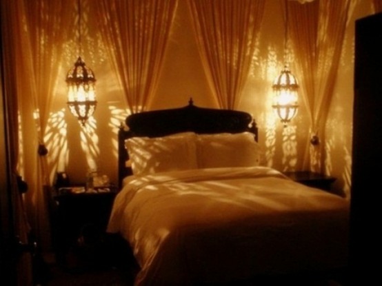 oversized Moroccan hanging lamps over the nightstands is a cool idea for a bedroom