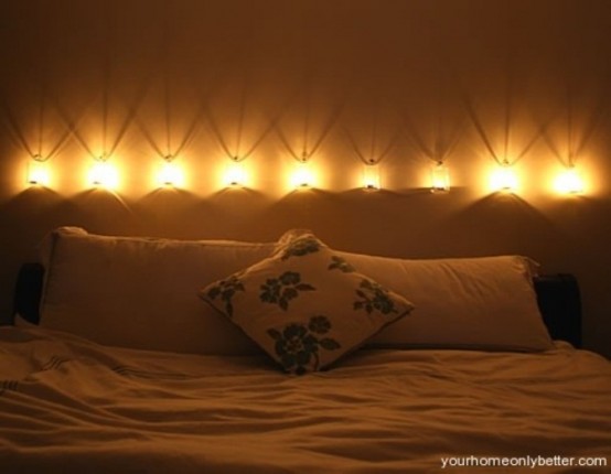 a row of wall lamps over the headboard will brign enough light and will look very stylish
