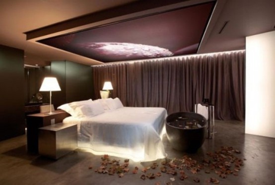 a bed with inner lights and an artwork with lights over the bed
