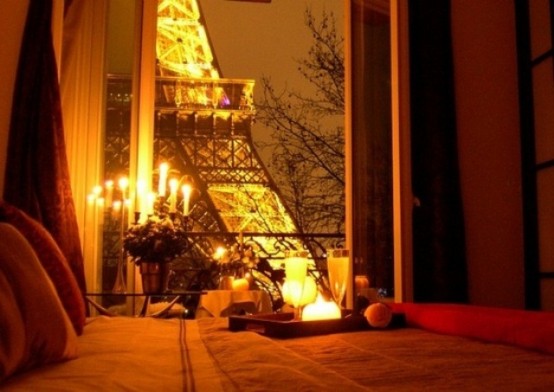 a candelabra and some candle holders look very romantic and cute and the Eiffel Tower adds to it