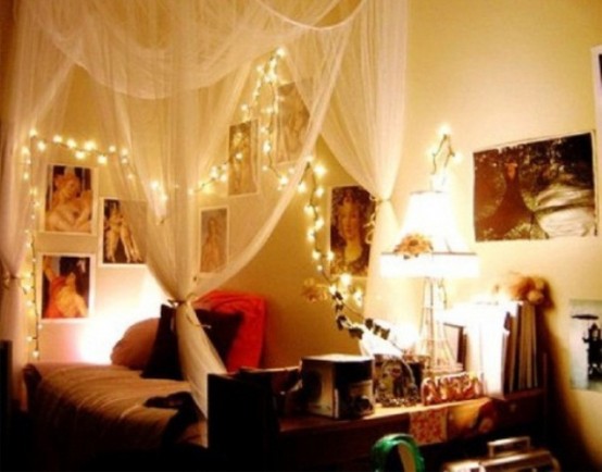 sheer curtains and lights over the bed for a romantic ambience