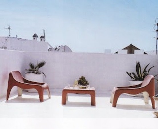 This terrace is a great example of breathtaking minimalism. A low table and two chairs are only things you really need there.
