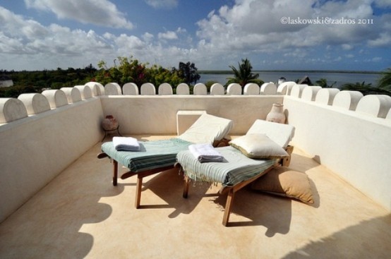 Simple muted colors of this terrace won't distract from admiring the nature around it.