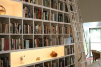 rows of matching Billy bookcases from Ikea will do the trick if you want to to furnish a home library