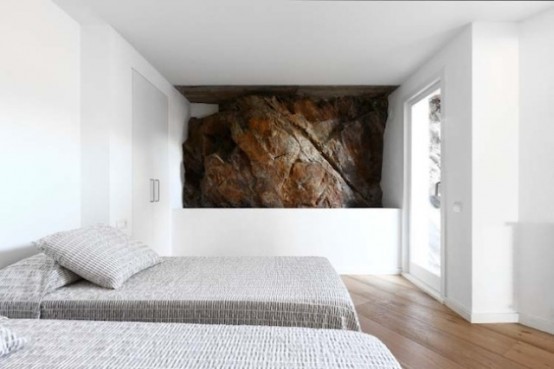 Rustic House With Massive Rock Formations In The Interior