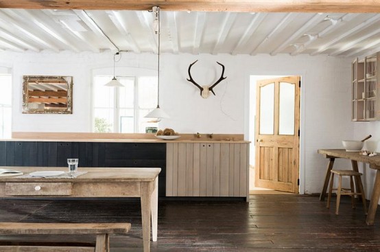 Rustic Kitchen With An Extensive Use Of Rough Wood