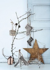 Nordic Christmas decor with branches, plywood stars, stockings, pinecones is simple and natural