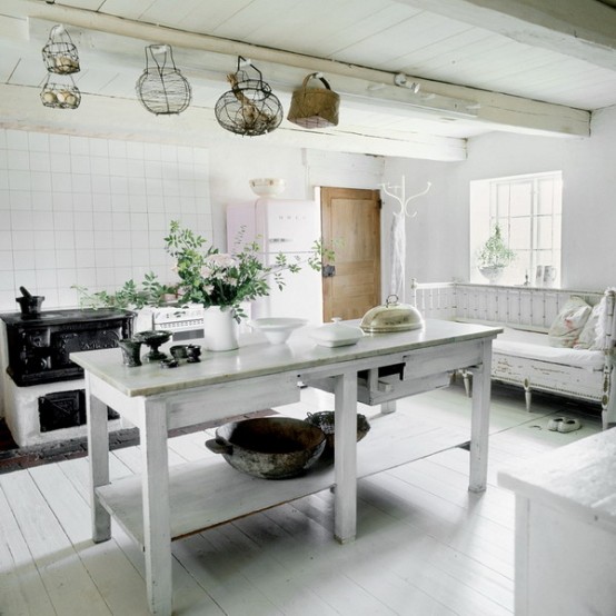 a white Scandinavian kitchen with a vintage touch, a whitewashed kitchen island and bench, white cabinets and a vintage stove