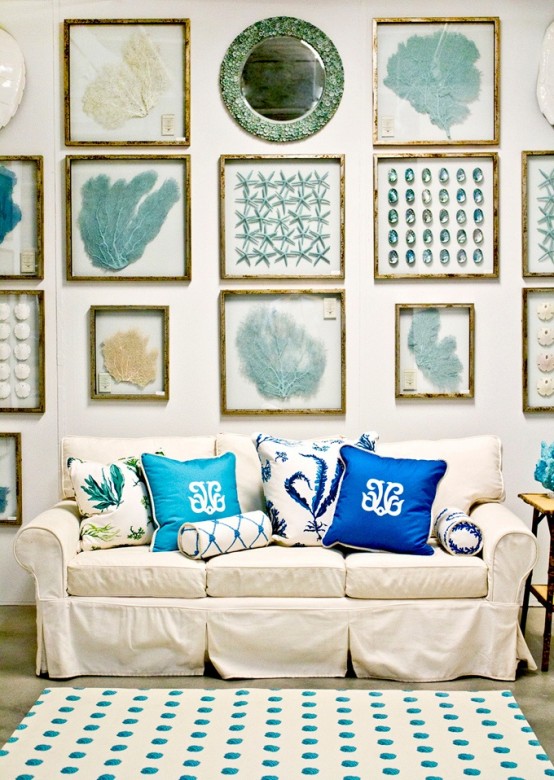 a neutral sofa and a bold gallery wall inspired by sea and sea creatures for a beach living room