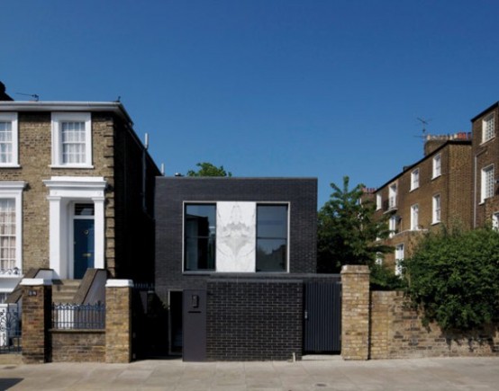 Shadow House Of Black Brick With Industrial Decor