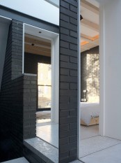 Shadow House Of Black Brick With Industrial Decor