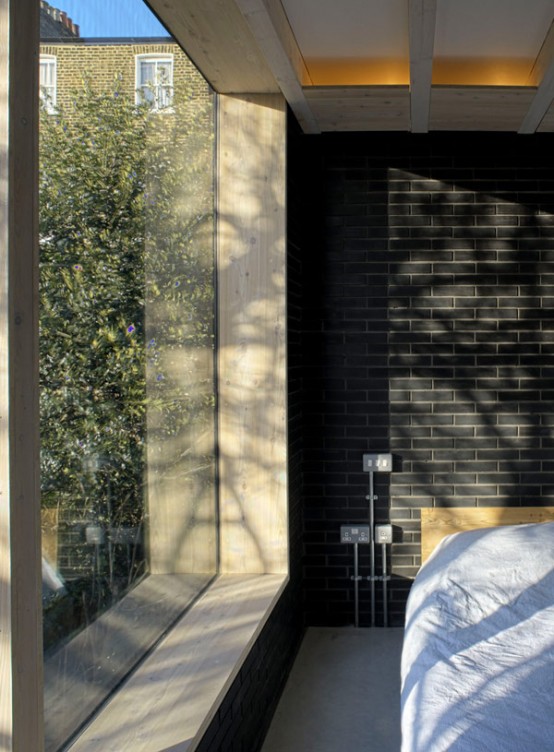 Shadow House Of Black Brick With Industrial Decor