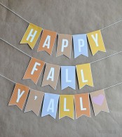 a colorful fall paper banner is a lovely decor idea for Thanksgiving, too, and it’s super easy to make yourself