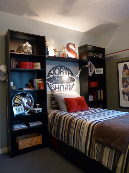 Simple boys' room design with several bookcases two display all those cool things.