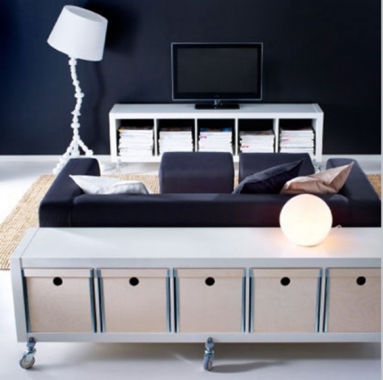 Casters are great additions to a console unit if you want to change the layout of your living room often. Baskets basically become drawers when tucked inside small bookshelves.

