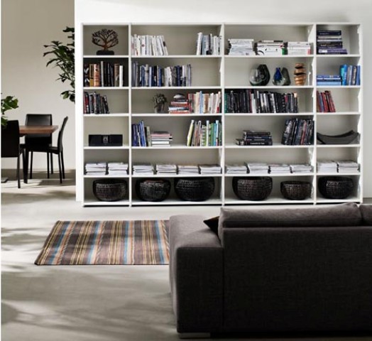Matching bookcases not only provide lots of space for books, baskets and some flea market finds but also give your living architectural presence.