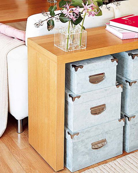 A console table adds storage and makes the living room looks more interesting. Boxes, baskets or bins are perfect organizers for such storage solution.