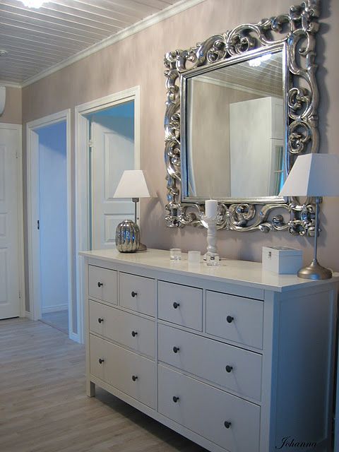 It's a practical console table for an entryway with lots of storage drawers.