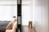 sleek grey masculine headboard with storage