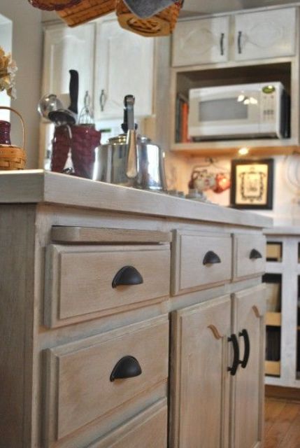 a whitewashed cabinet for a modern or farmhouse kitchen is a lovely idea - just whitewash your own stained cabinet and voila