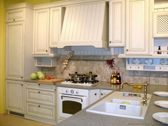 a whitewashed vintage kitchen with a matching hood is a pretty idea for those who love everything delicate and lightweight-looking