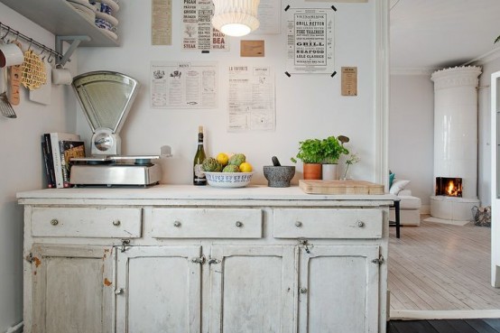 a vintage whitewashed kitchen cabinet like this one is a great idea for a vintage or shabby chic space and it looks rather lightweight