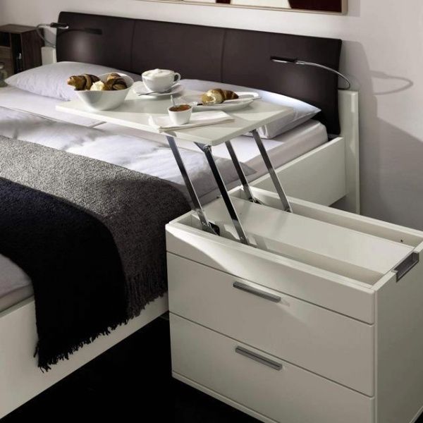 a white nightstand with an additional breakfast table that can be folded back is a perfect piece for a great morning