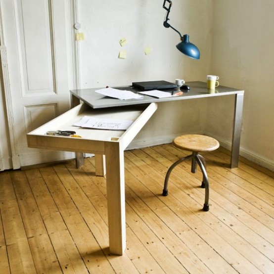a desk with a foldable part that can be used for storage or for working or it is a creative option