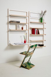 a white storage unit with all the foldable shelves and a desk and various stuff like books and blooms is a very cool idea