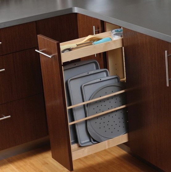 a narrow drawer used to store cutting boards and utensils is a smart and cool idea for any kitchen