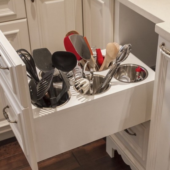 a drawer with holders for utensils is a very smart and cool idea for every kitchen, especially if you cook much